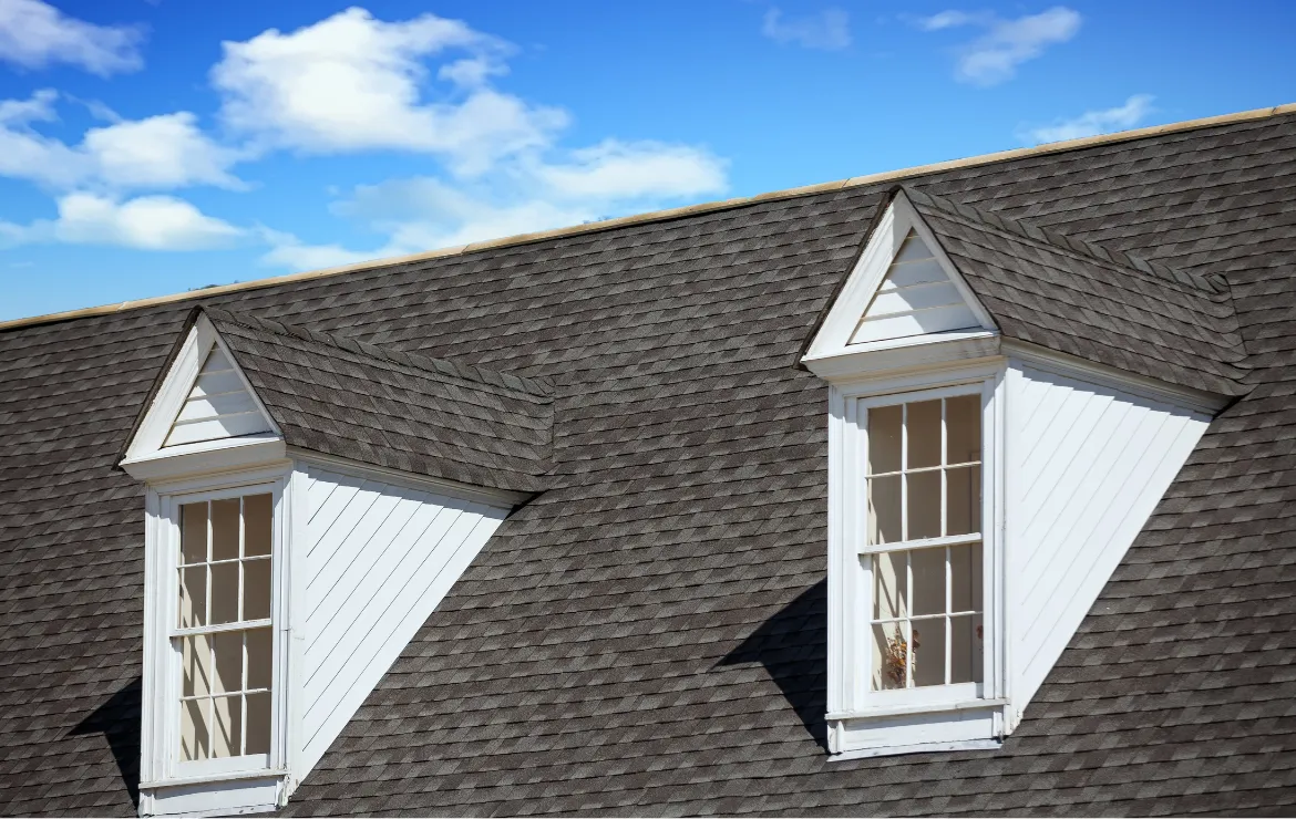 Charming dormer roof with a gable design, adding architectural flair and natural light to a home's interior.